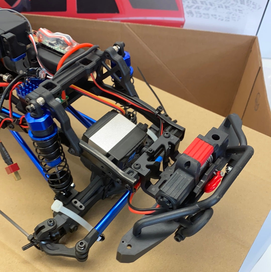 Crawler truck components: motors, chassis, and electronics laid out for IMEX 22020