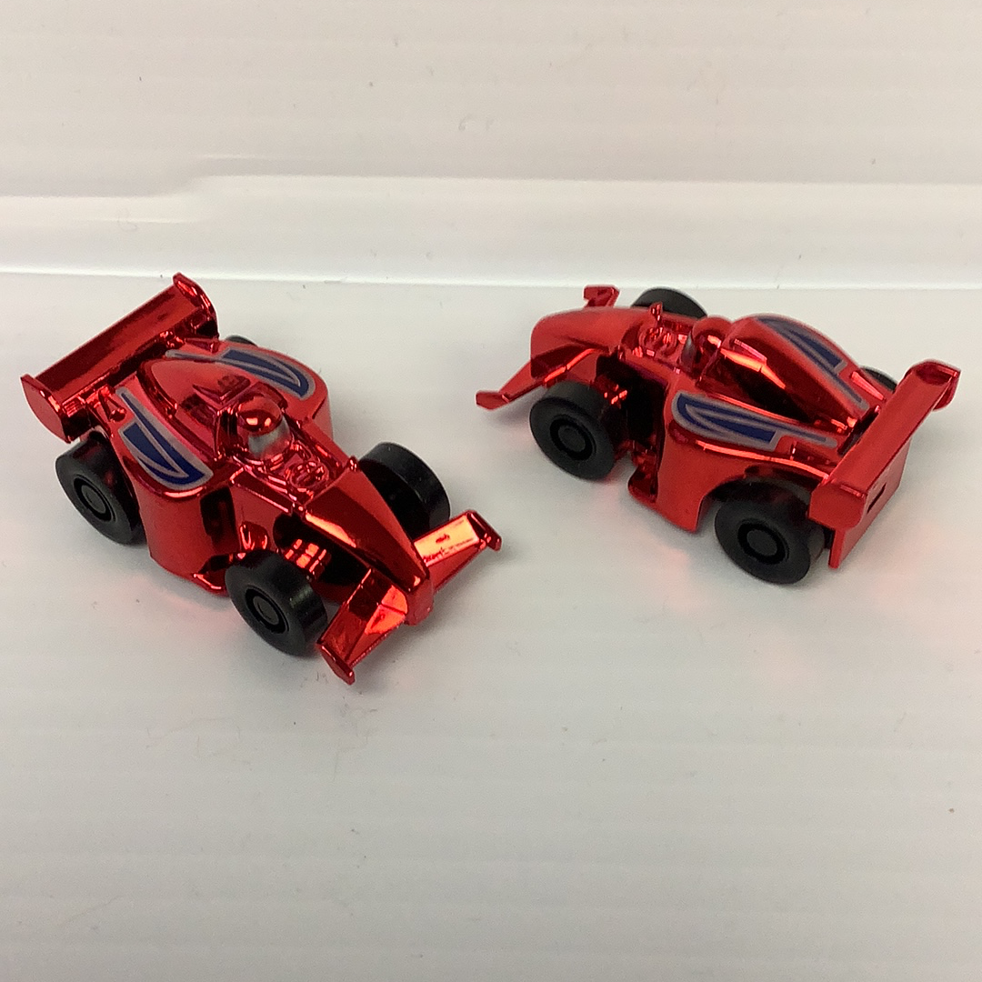 Two red, vintage-style race cars on a white surface for California Creations 20451, rear view