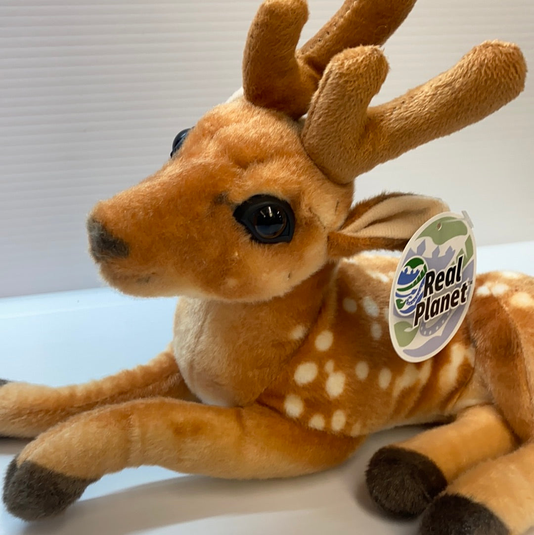 Stuffed deer toy lying down with small antlers and spotted fur for Real Planet DE32P