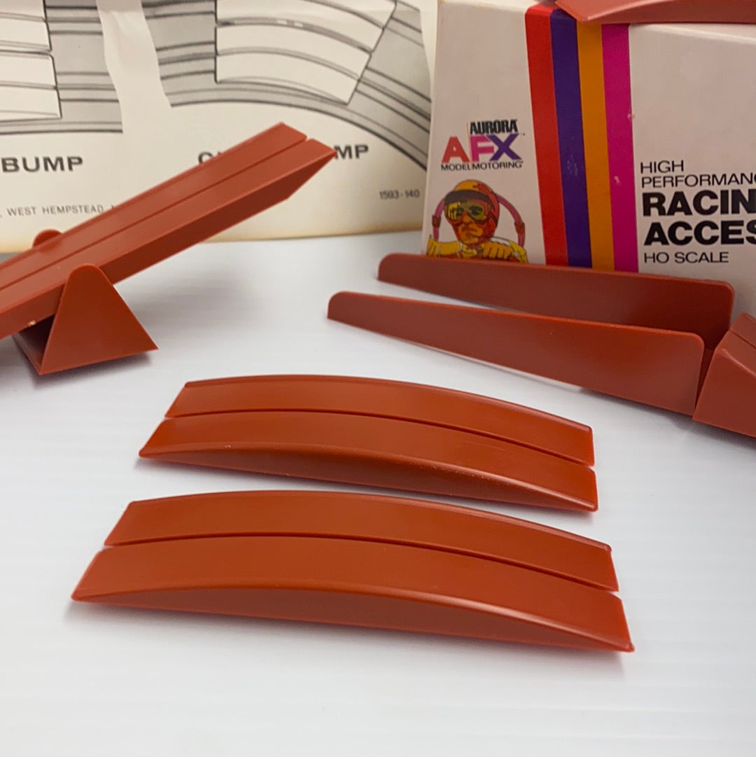 Curved, brown plastic track pieces for model obstacle course building for Aurora AFX Vintage 1593