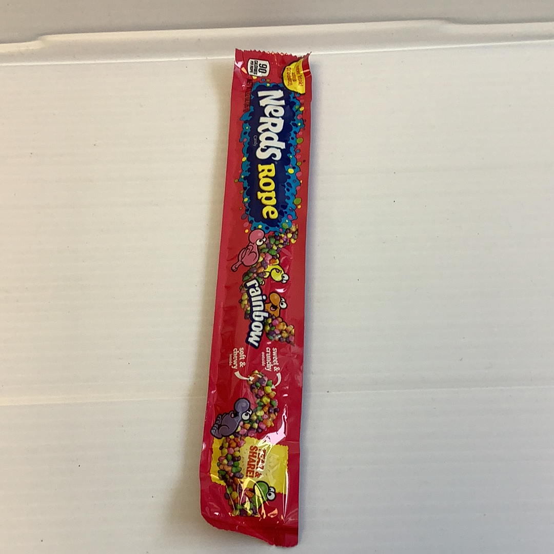 Red and white candy rope wrapper featuring colorful candy shapes for Nassau Candy 5604