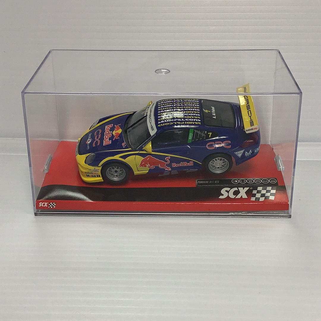 Slot car of a blue and yellow Porsche 911 GT3 Cup race car for SCX A10119X3U0
