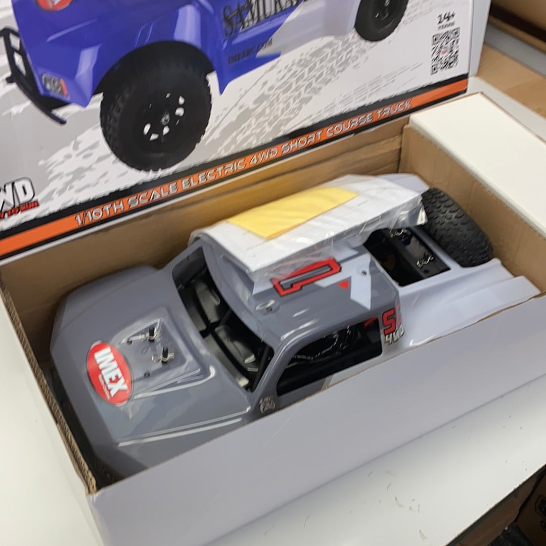 Gray 1/10 scale remote-controlled truck in its box for IMEX 22010