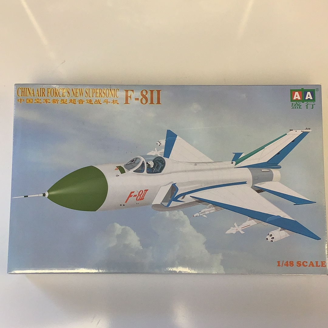 Model kit box art showing a green and white F-8II supersonic jet fighter for IMEX AA0004
