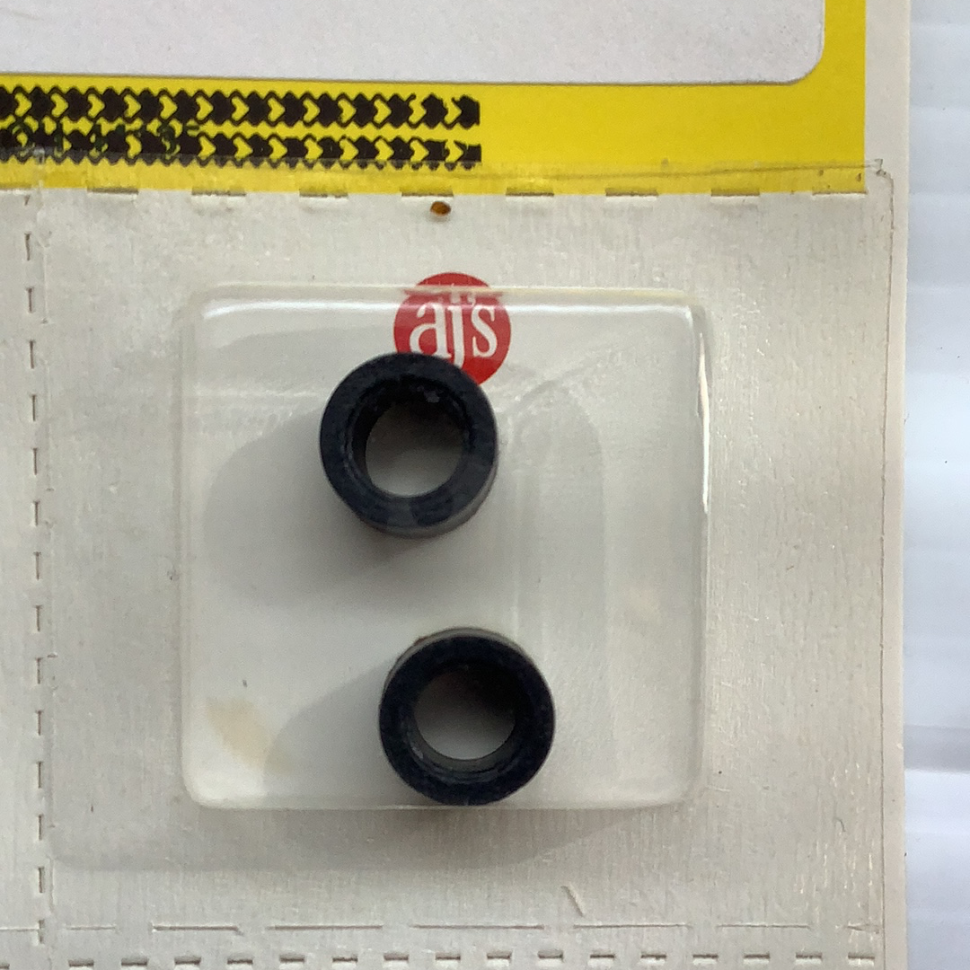 Two black silicone tire inner tubes displayed on a white card for HO Tires Silicone Fits C and D Black Tires 011