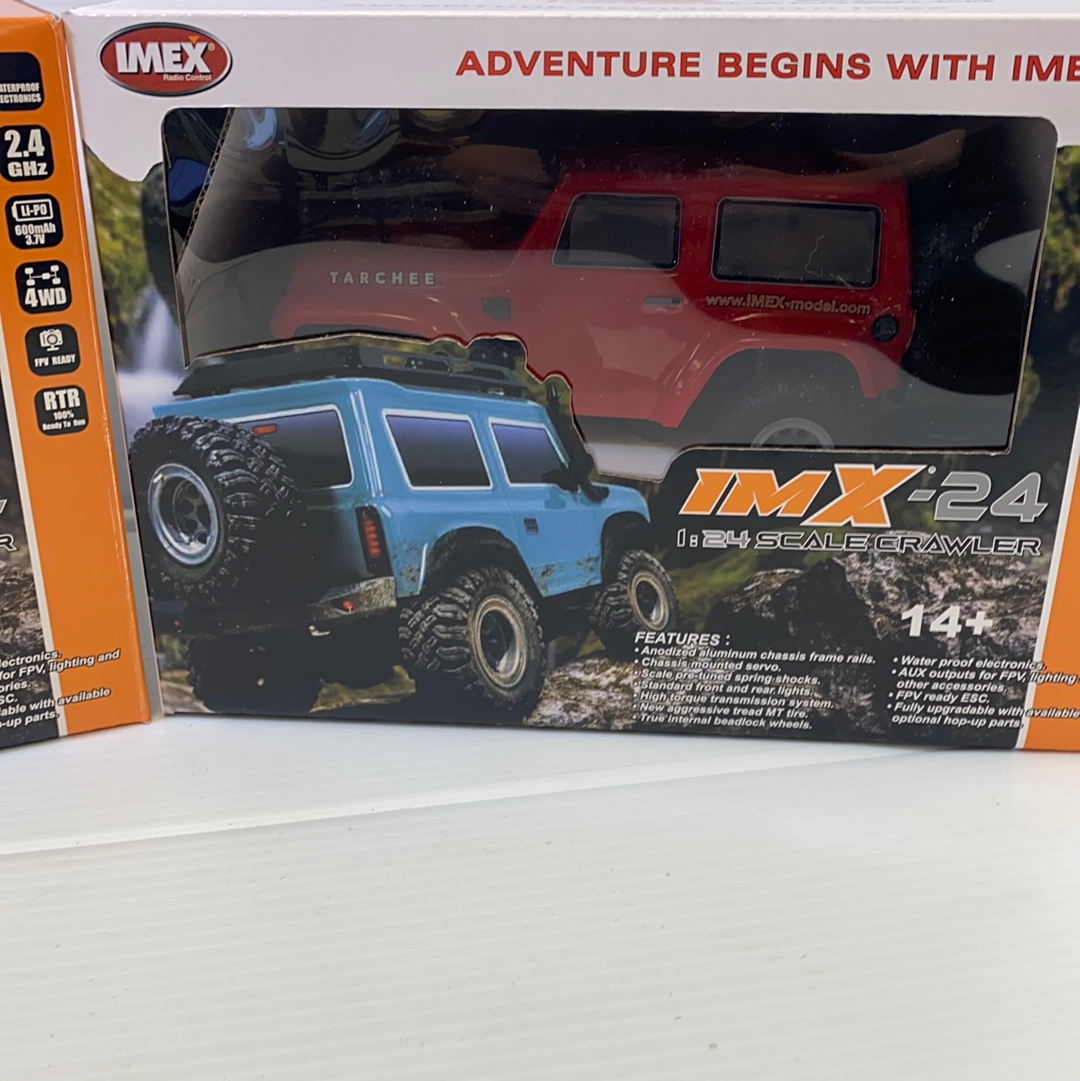 Blue scale crawler toy vehicle on its box packaging for IMX IMX25055