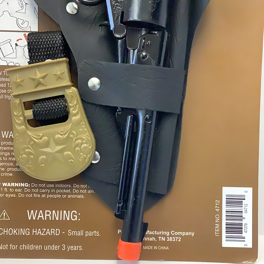 Black revolver in a holster with warning labels visible for Parris Toys 4712