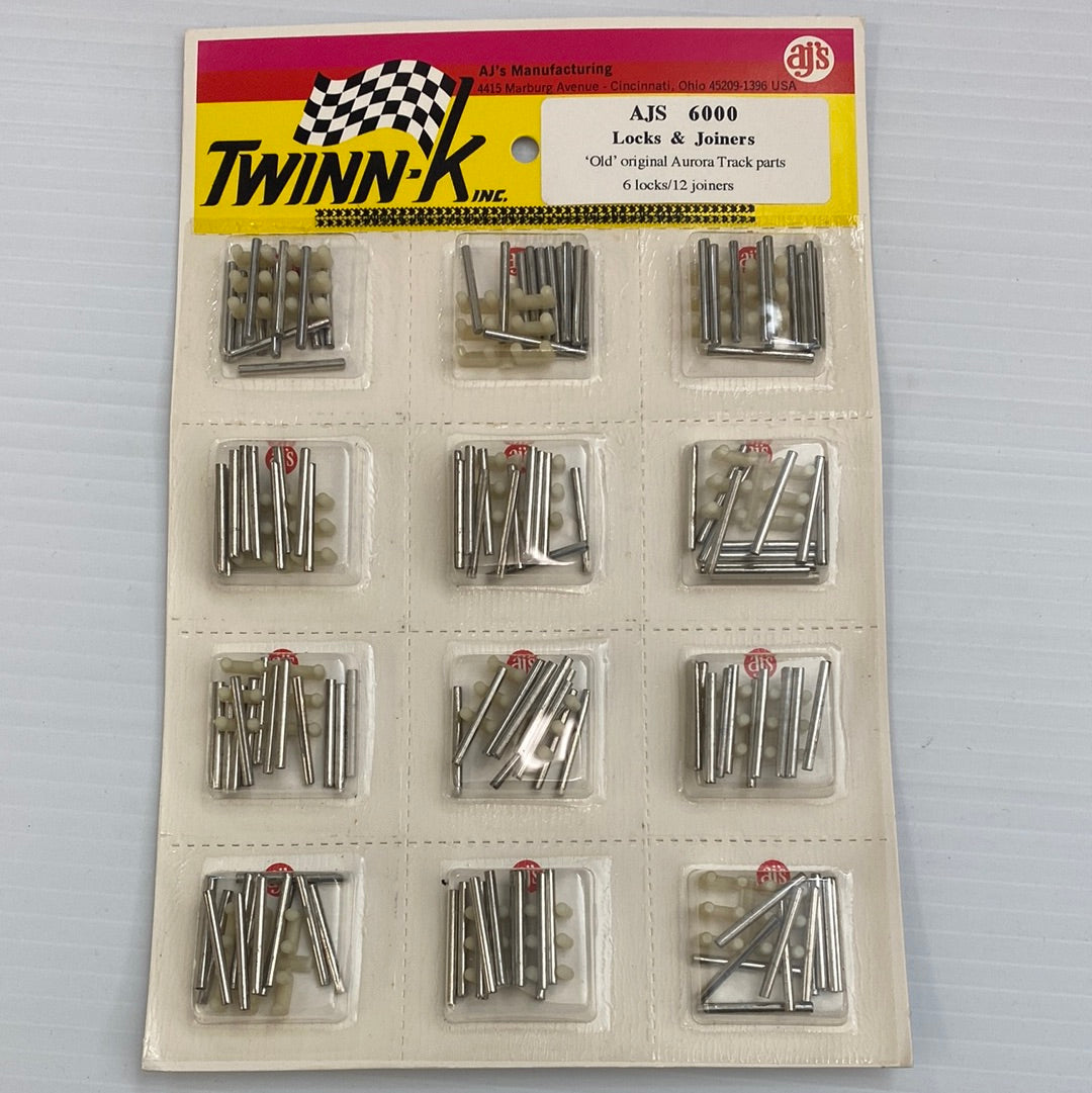 Assortment of slot car track locks and joiners in plastic packaging for AJ'S Slot Car Parts 6000