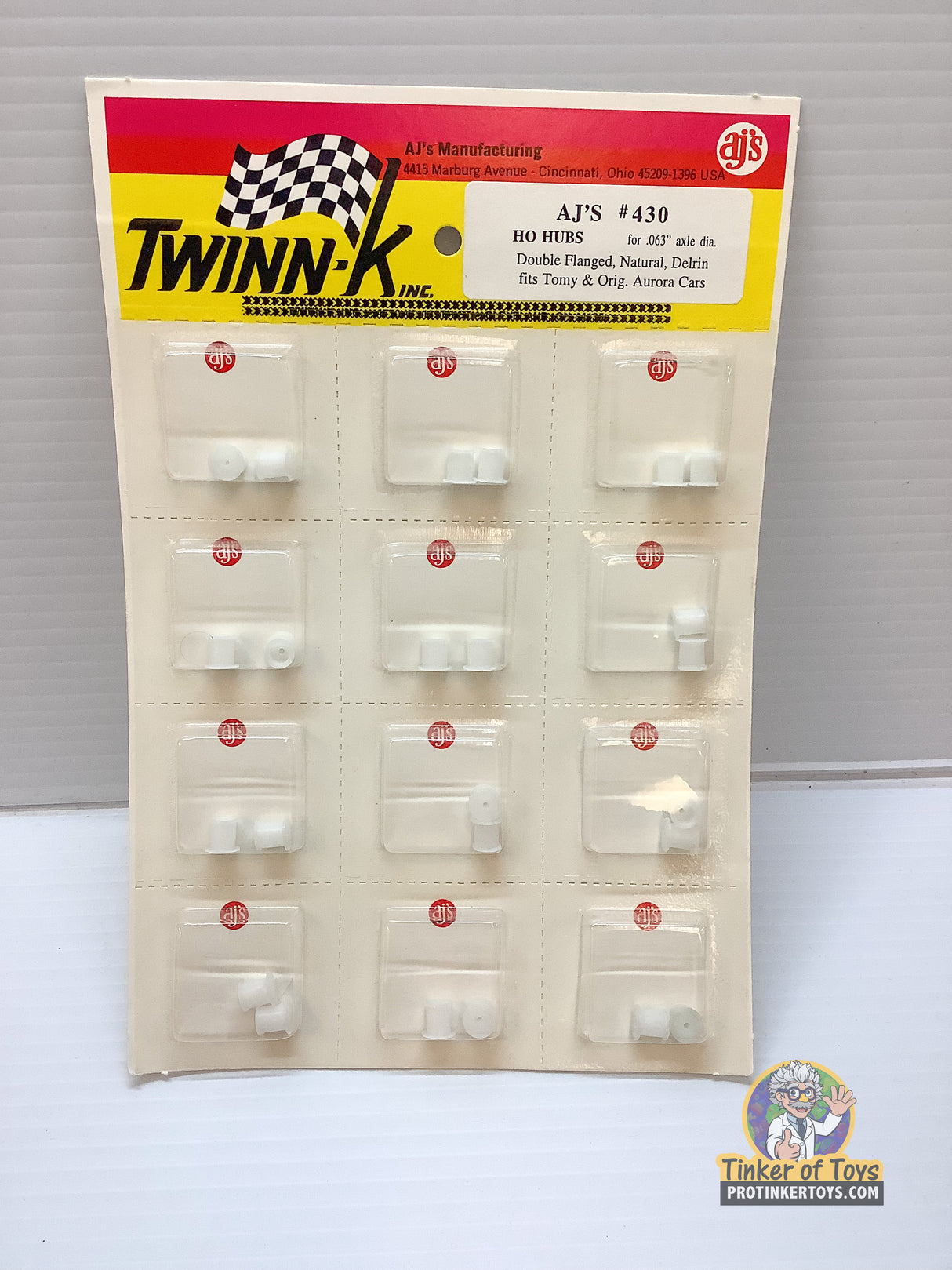 Assortment of small, white plastic hubs for model train axles for HO Hubs for .063" axle dia 430
