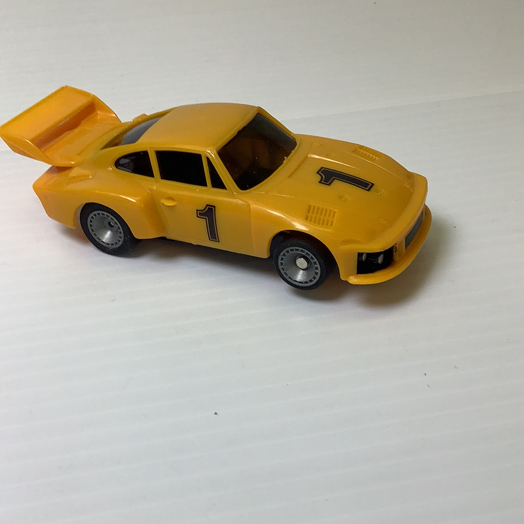 Yellow scale model car with hood open, showing the engine bay for Bachmann BAC0002
