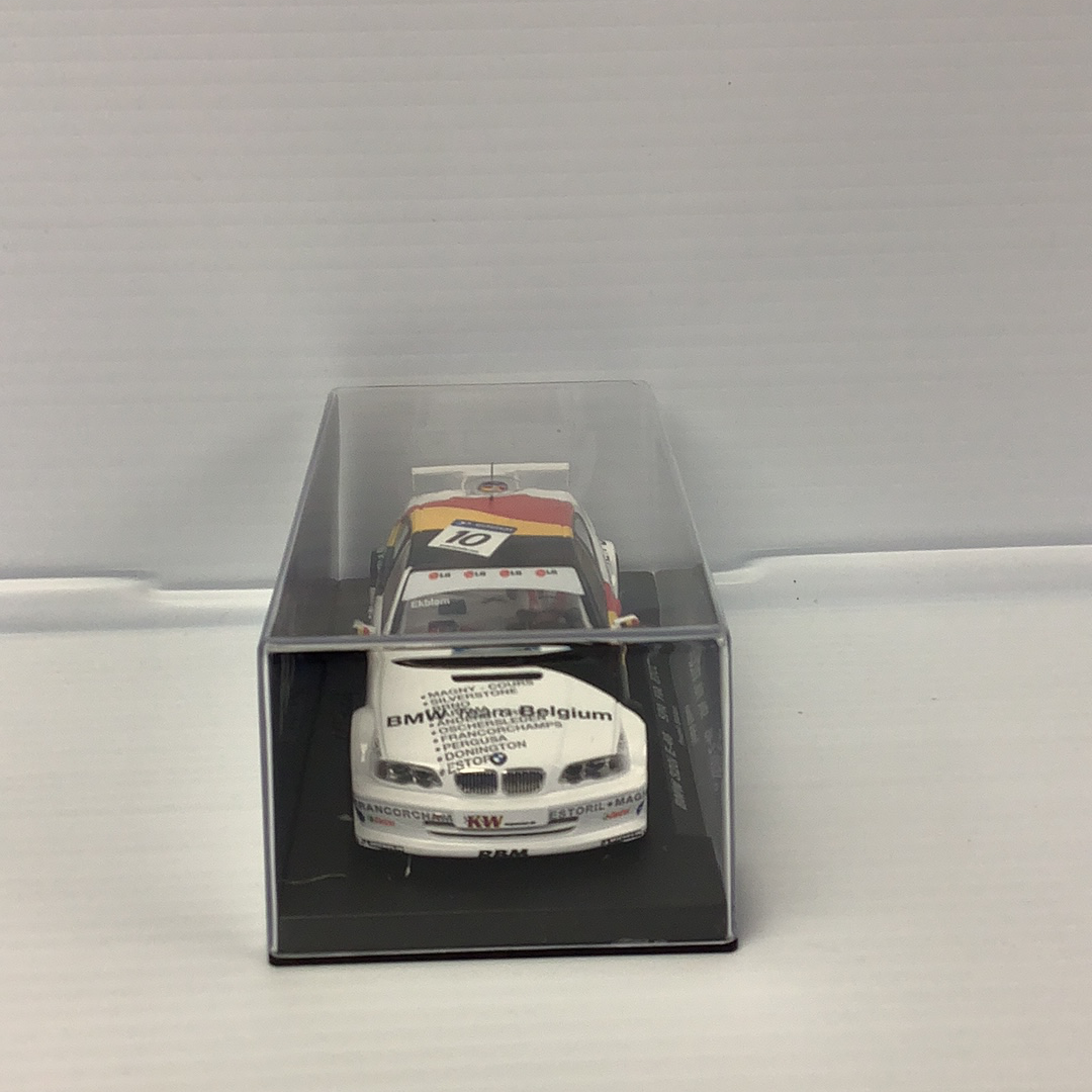 Slot car of a 2002 BMW 320I E-46 race car in a display case for Fly Car 88090