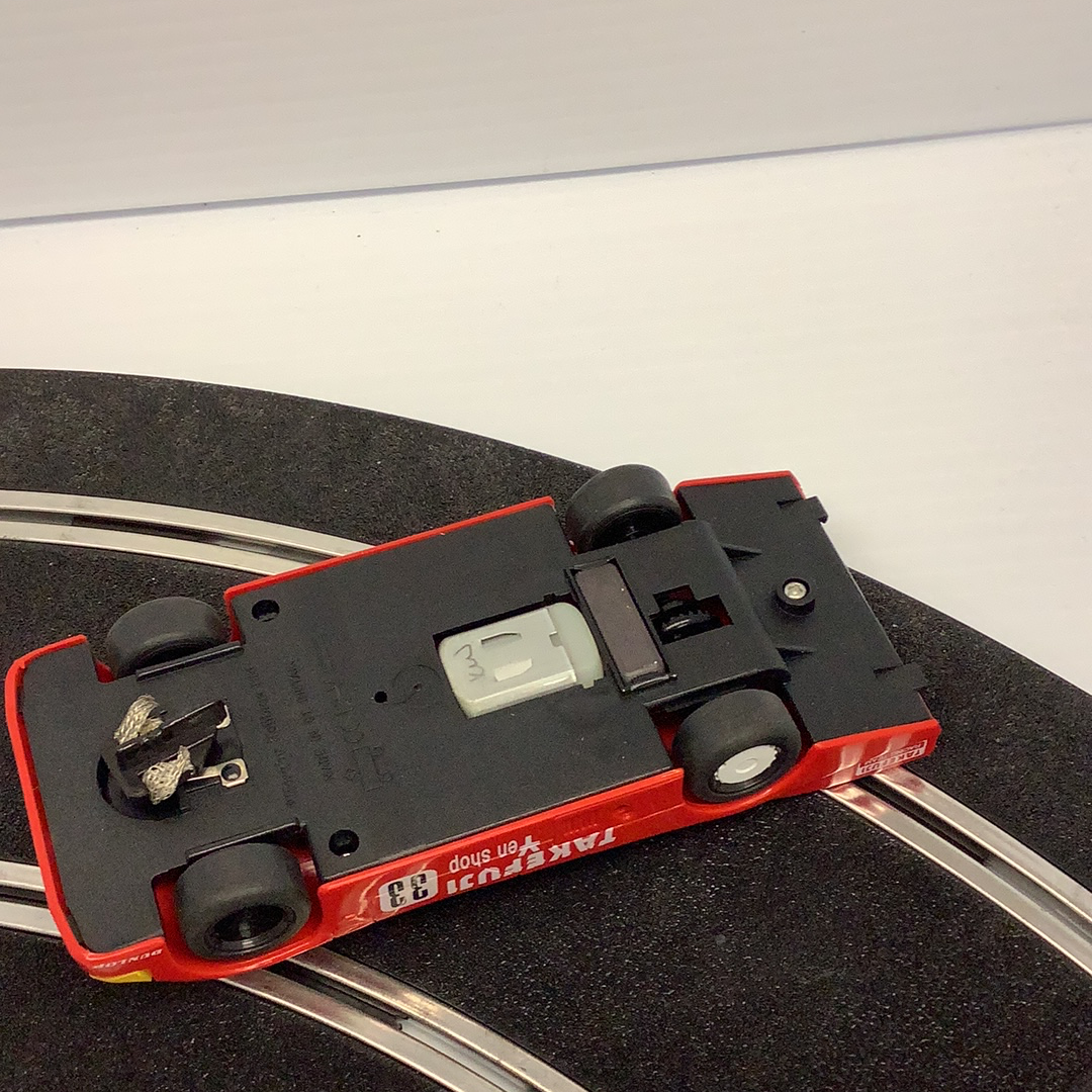Red Porsche race car model on track section for Scalextric C188