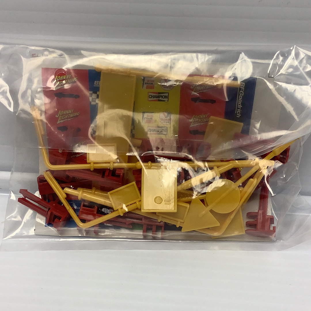 Assorted red, yellow, and white plastic flags and signs for display for Johnny Lighting JL2007