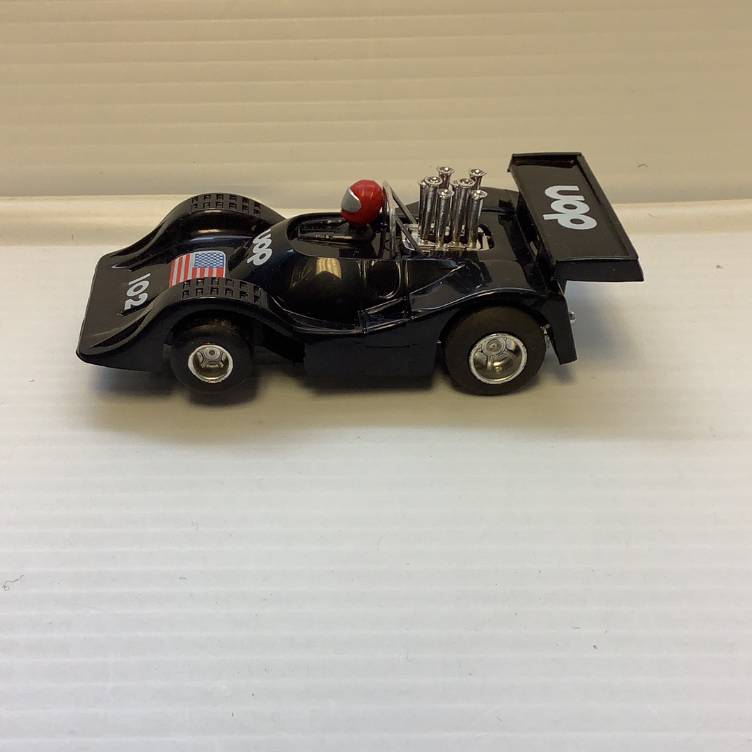 Black slot car replica with UOP markings, detailed model for REH Polistil A.108