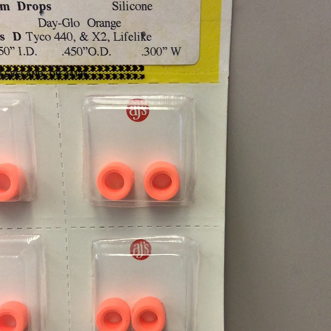 Silicone gum drops in day-glo orange, showing various sizes for Gum Drops Silicone Day-Glo Orange Tires 018