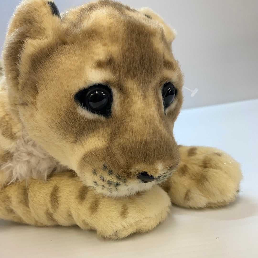 Stuffed lion cub toy lying down, realistic tan and brown fur for Real Planet LC48