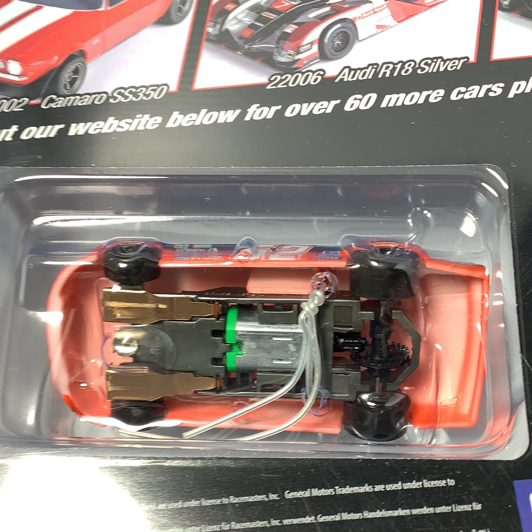 Red slot car model in clear plastic packaging for AFX/Racemasters 22041