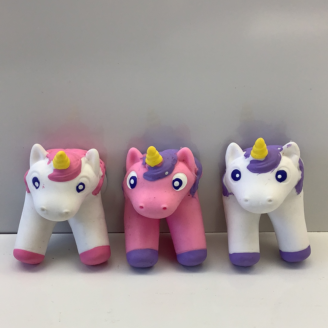 Three colorful unicorn finger puppets standing side-by-side for IMEX-Toys 88455NV