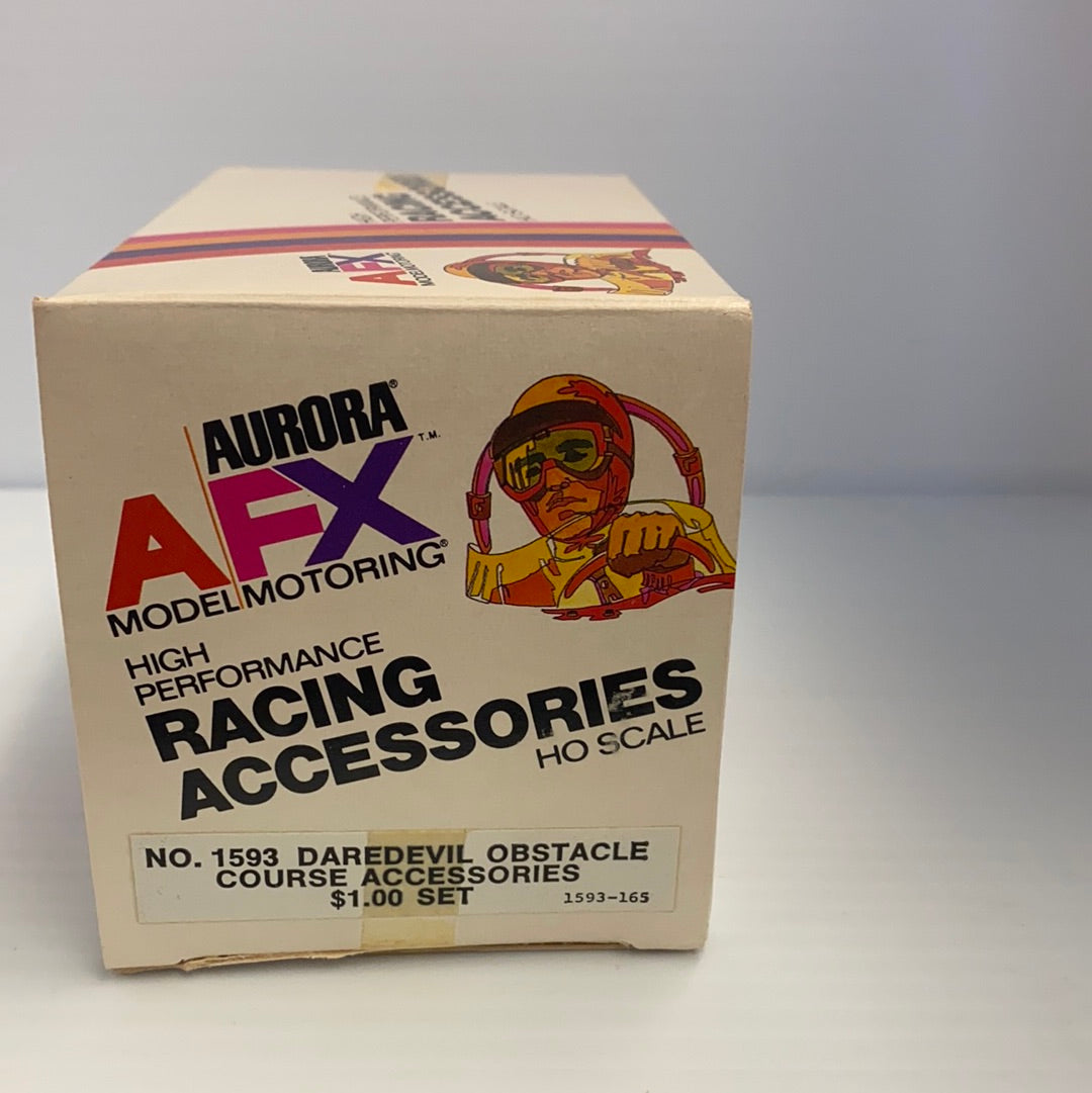 Box art for Aurora AFX model car racing accessories, featuring a daredevil figure for Aurora AFX Vintage 1593