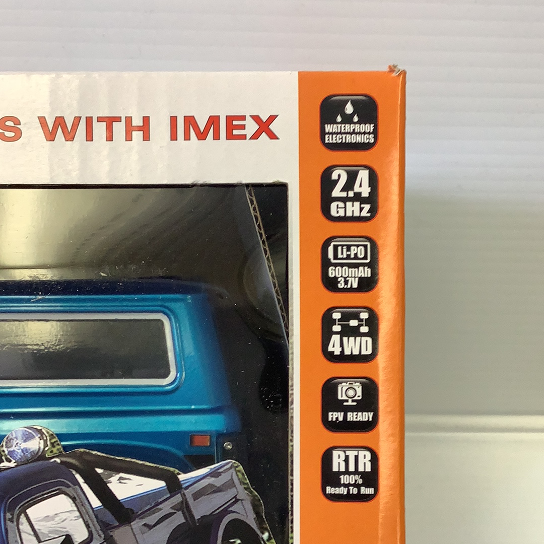 Remote control crawler vehicle with electronics details visible on the box for IMX IMX25005