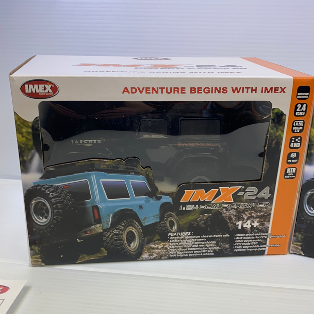 Blue 1/24 scale crawler vehicle on its box for IMX IMX25055