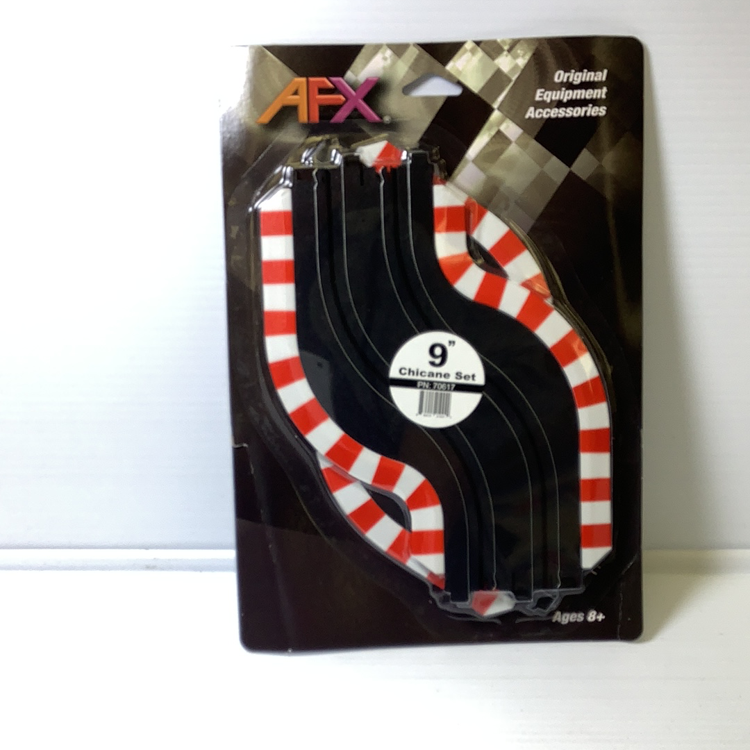 Black and red striped track chicanes for racing, packaged for ages 8+ for AFX RaceMaster 70617