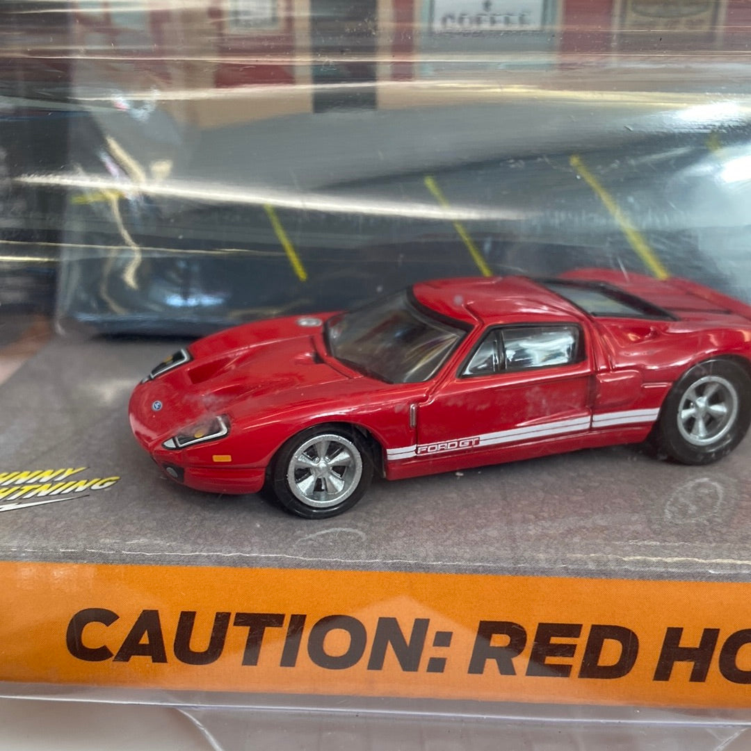 Red Ford GT die-cast car on display card for Johnny Lightning JLDR004R