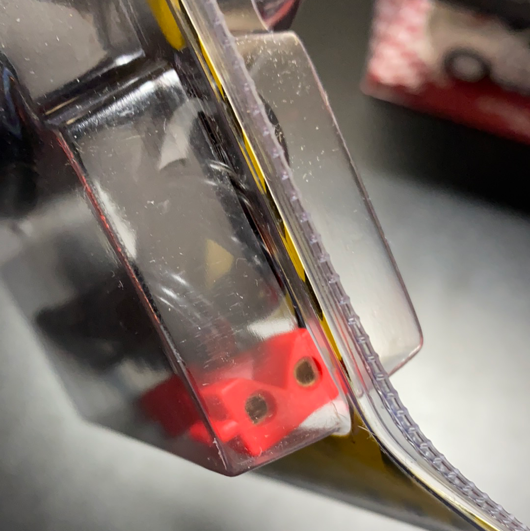 Red electrical terminals visible on a power output connector for SCX 88060