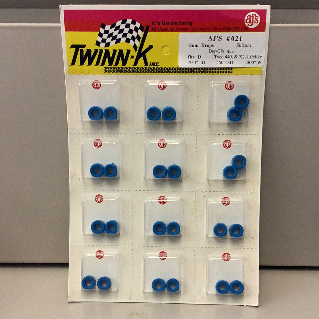 Silicone tire assortment in blue, arranged on a white card with branding for Gum Drops Silicone Day-Glo Blue Tires 021