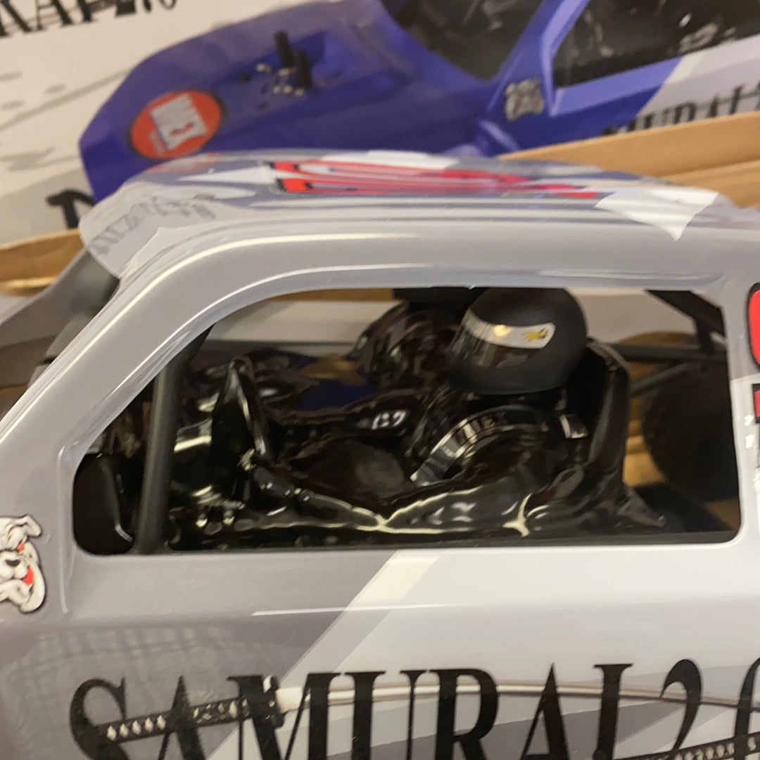 Interior view of a gray remote-controlled car, showing the motor and chassis for IMEX 22010