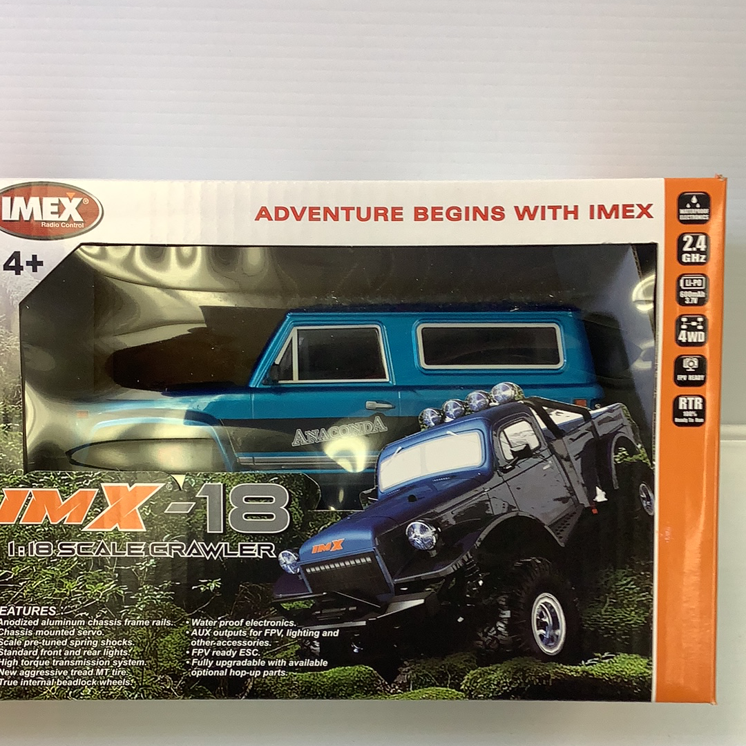 Two scale crawlers, one blue and one dark, displayed on a box for IMX IMX25005