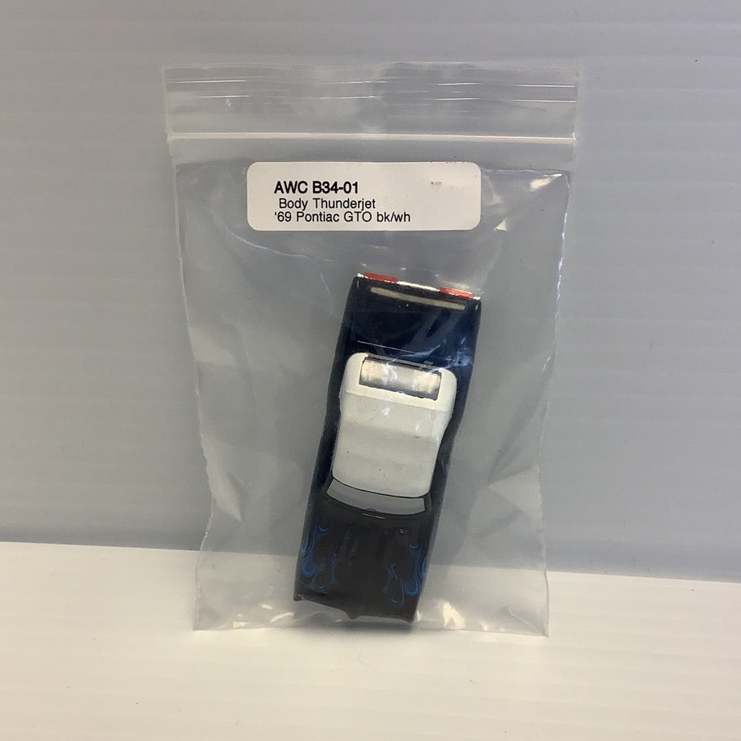 Die-cast model of a '69 Pontiac GTO in clear plastic packaging for American Line B34-01