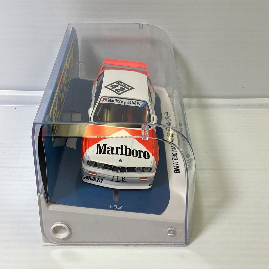 Slot car of a 1991 BMW E30 M3 DTM race car in a clear case for Scalextric C4168