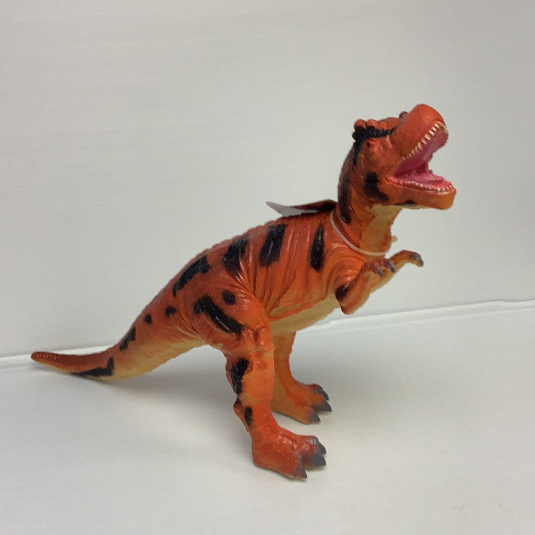 Orange T-Rex toy dinosaur model posed on a white surface for IMEX Model IMX49407