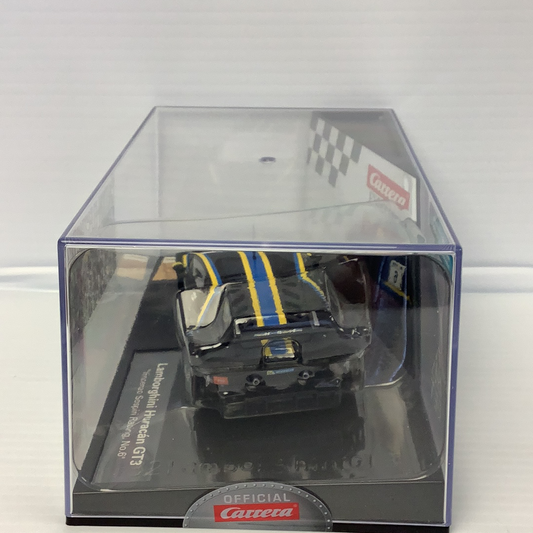 Black and yellow race car model in clear display box for Carrera 27595