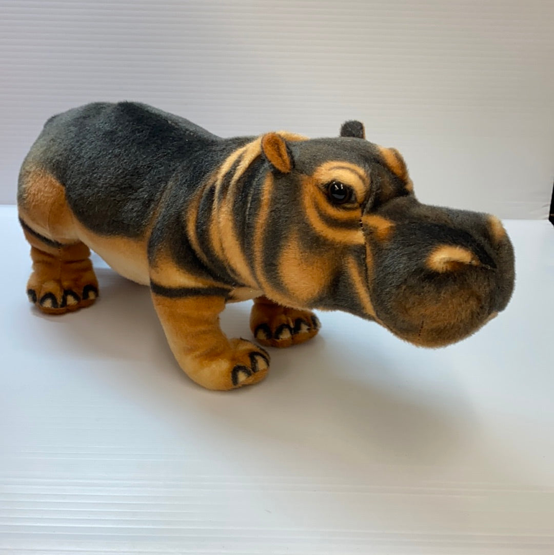 Stuffed hippo toy, brown and gray, sitting on a white surface for Real Planet HP38D