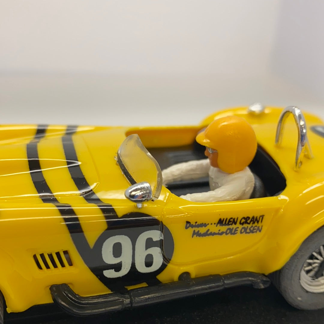 Yellow 1964 Shelby Cobra slot car with driver figure for REPROTEC RT/1964