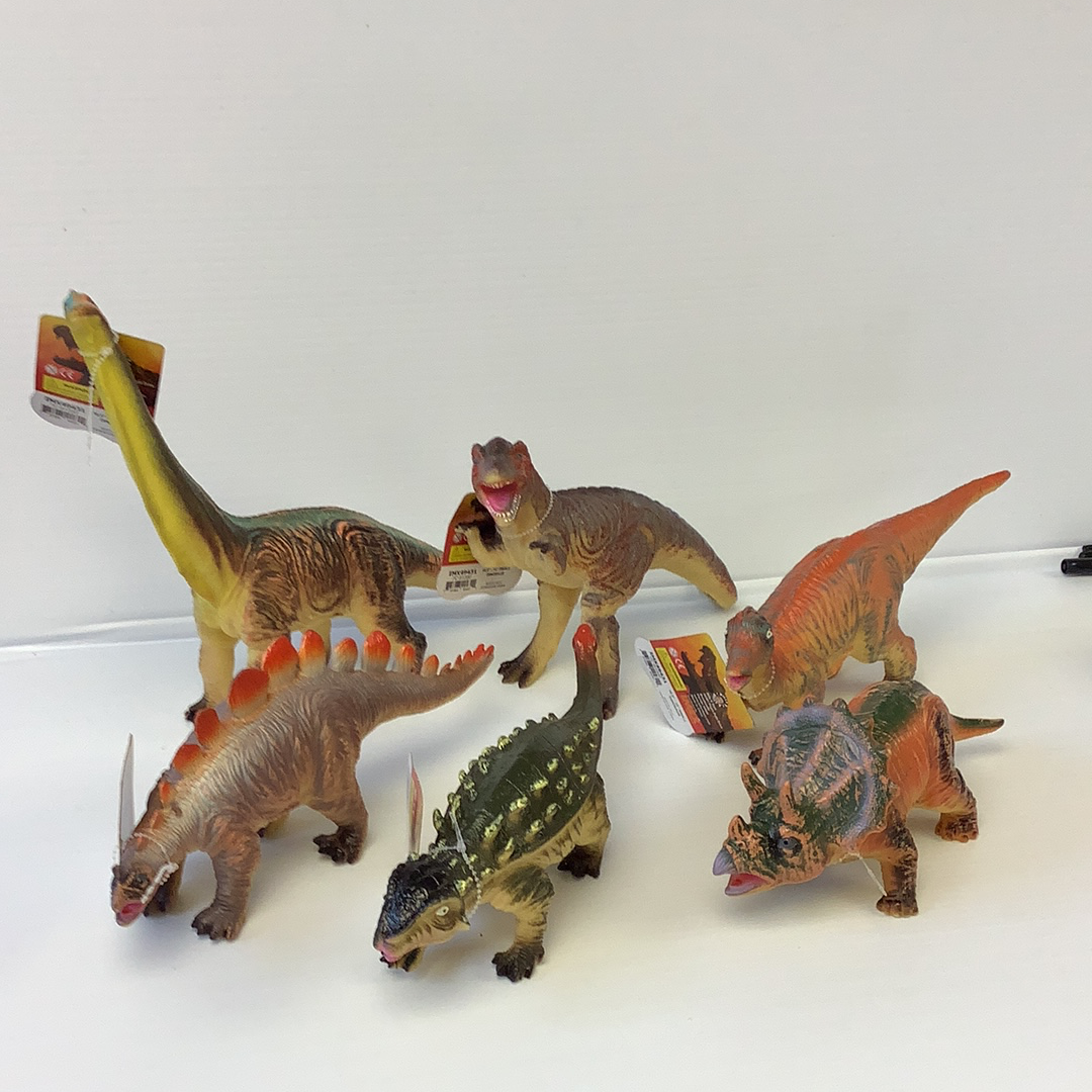 Assortment of colorful dinosaur toys displayed on a white surface for Schylling IMX49431