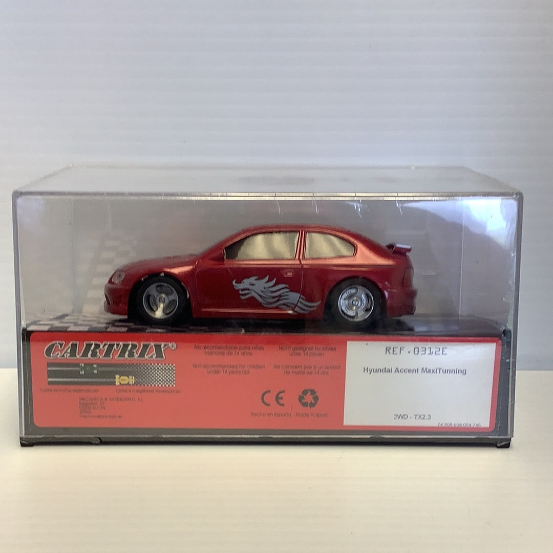 Red slot car of a Hyundai Accent Maxituning for CARTRIX 0312E