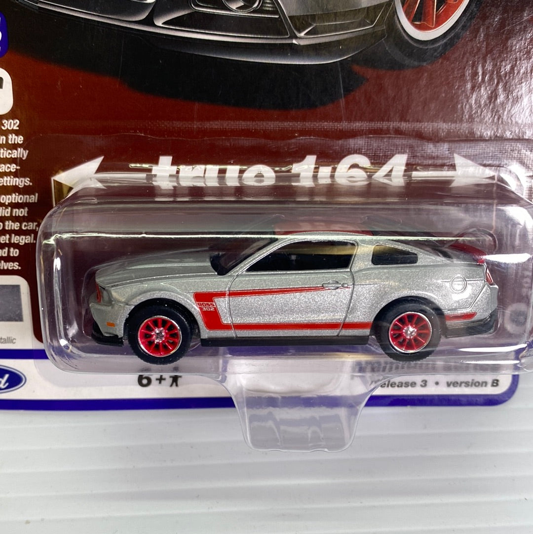 Silver muscle car die-cast toy with red wheels, displayed in clear plastic packaging for AW Die Cast AW64262