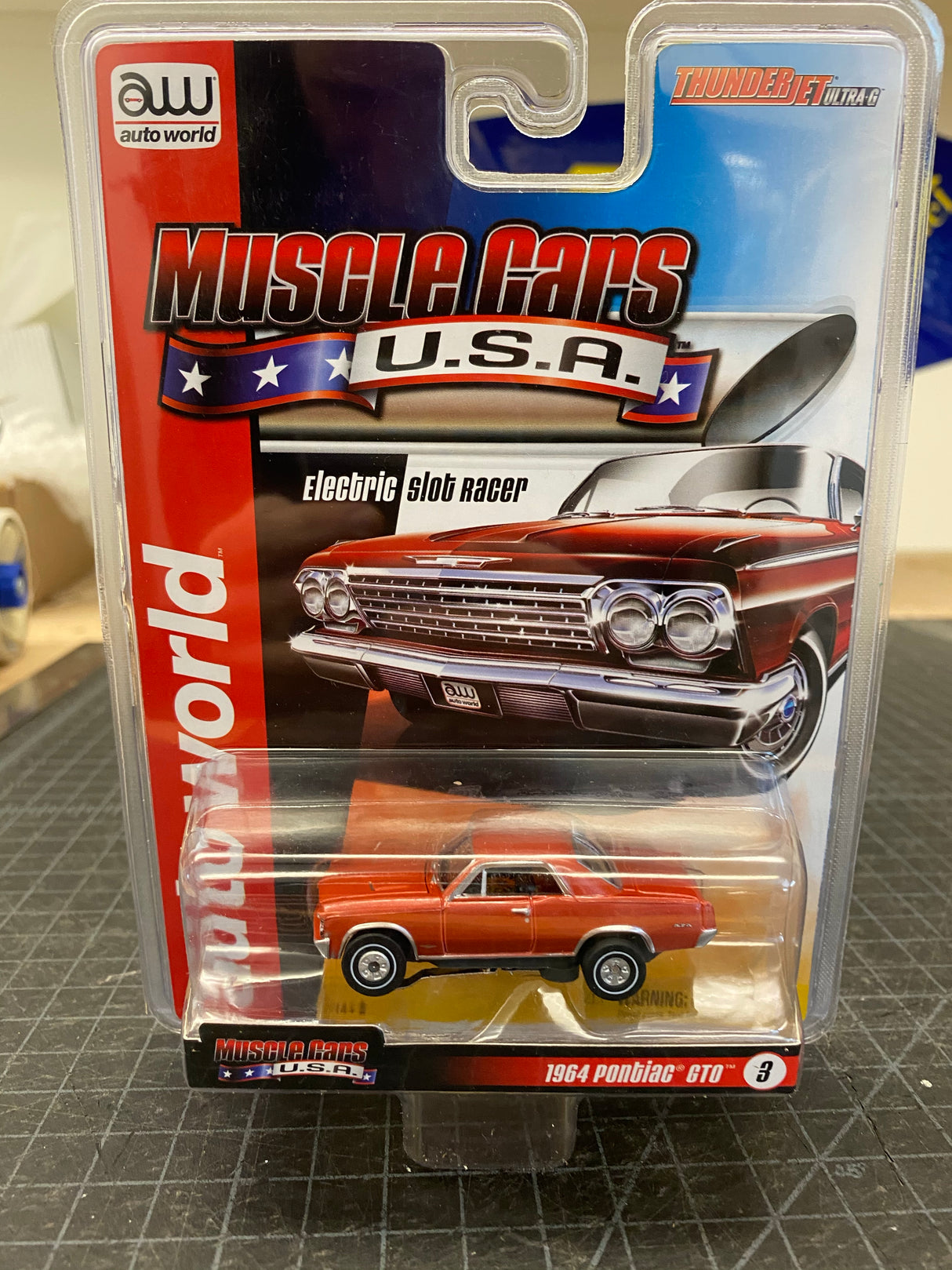 Auto World Thunderjet R25 Muscle Cars USA | SC340 | Auto World-Auto World-#3 1964 Pontiac GTO Red-ProTinkerToys