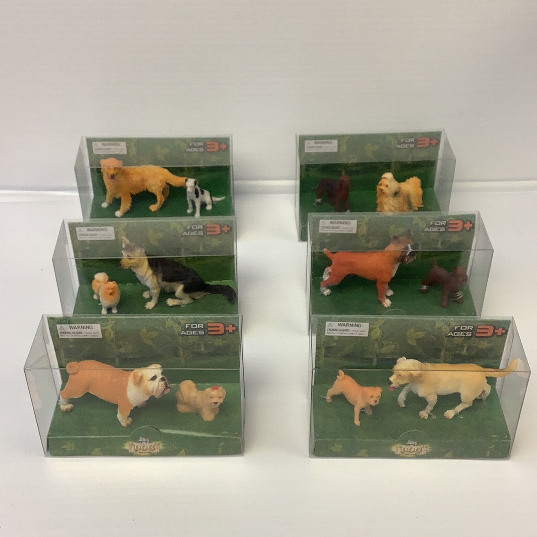 Assortment of dog toys displayed in clear plastic packaging for Schylling IMX49566