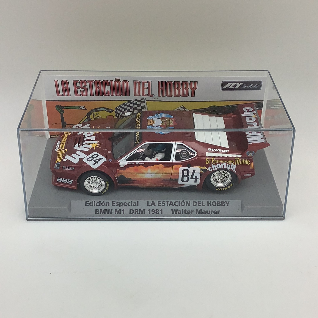 Slot car of a 1981 BMW M1 race car in a display box for Fly Car 99086