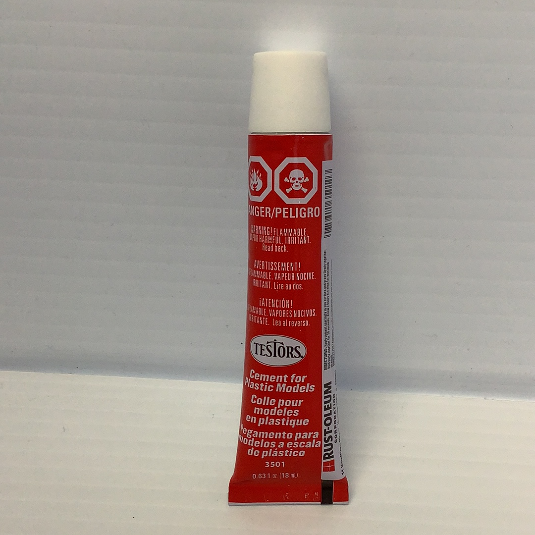 Plastic cement bottle with warning labels and product information for Testors TES3501X