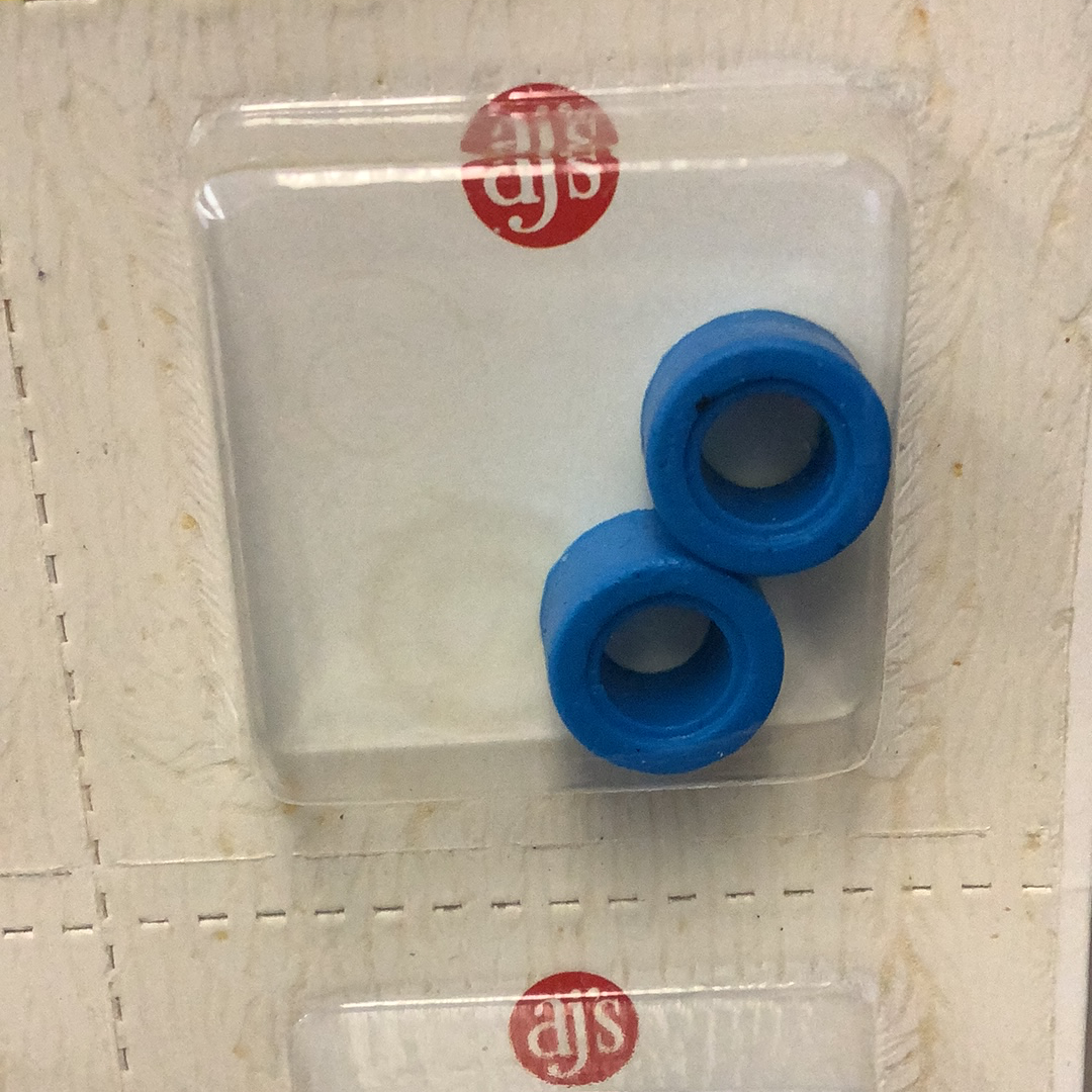 Two bright blue silicone rings, resembling tires, in a clear plastic container for Gum Drops Silicone Day-Glo Blue Tires 021