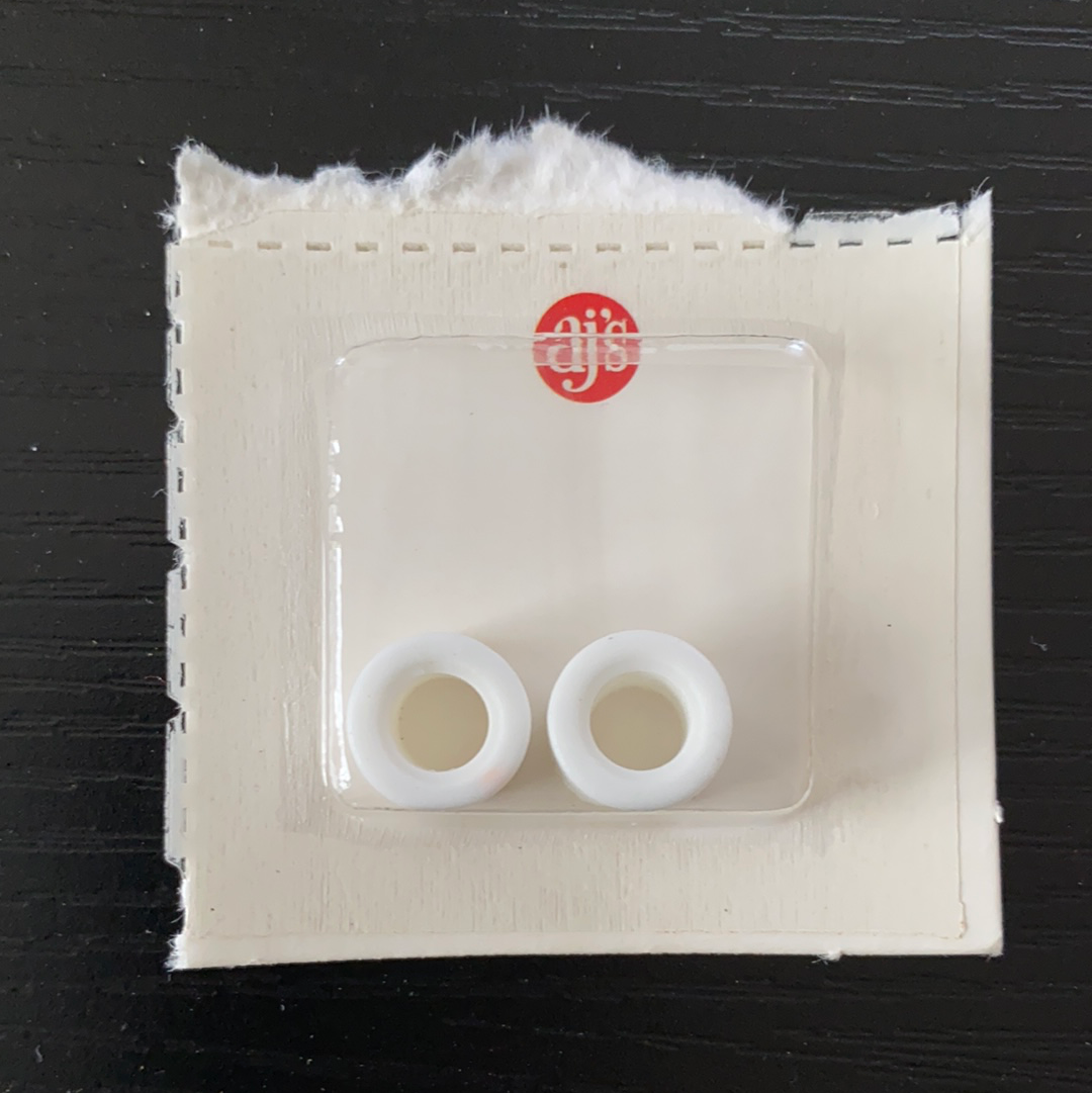 Two white silicone tires on a backing card for Gum Drops Silicone White Tires 020