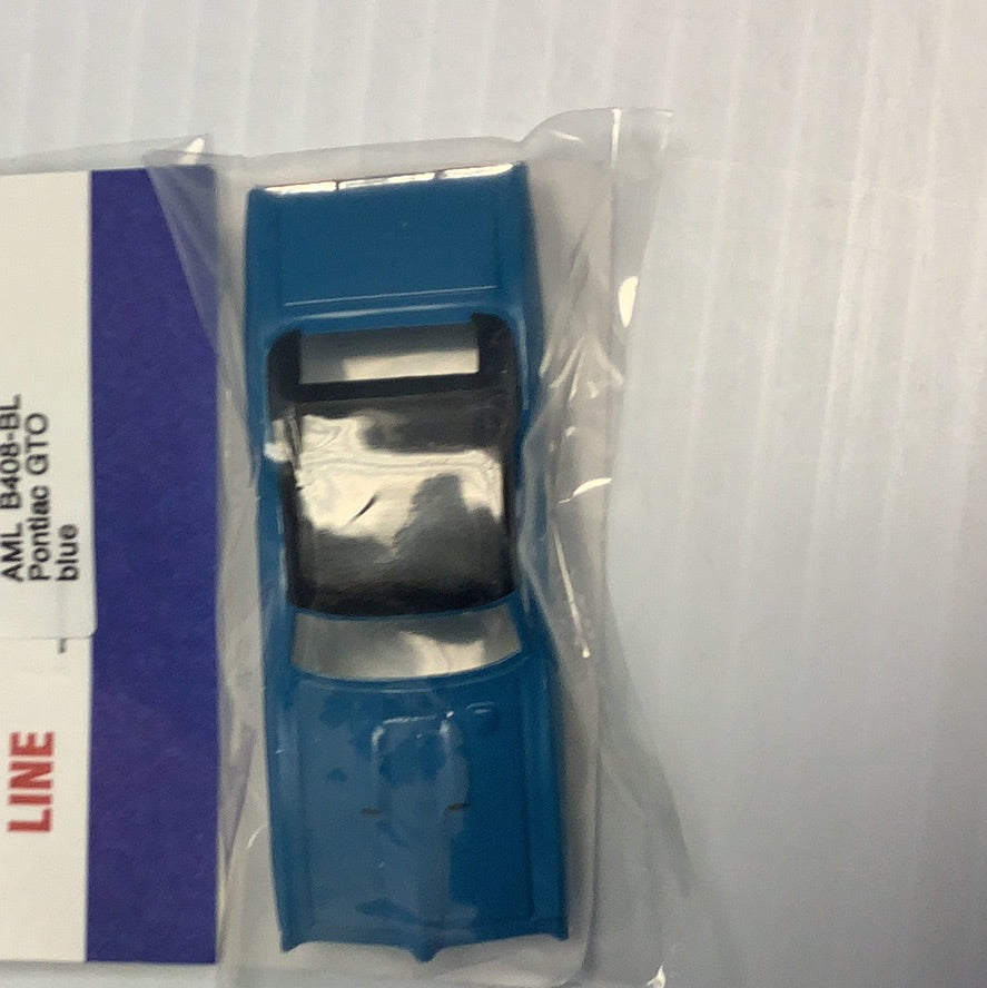 Blue die-cast model car of a Pontiac GTO for American Line B408
