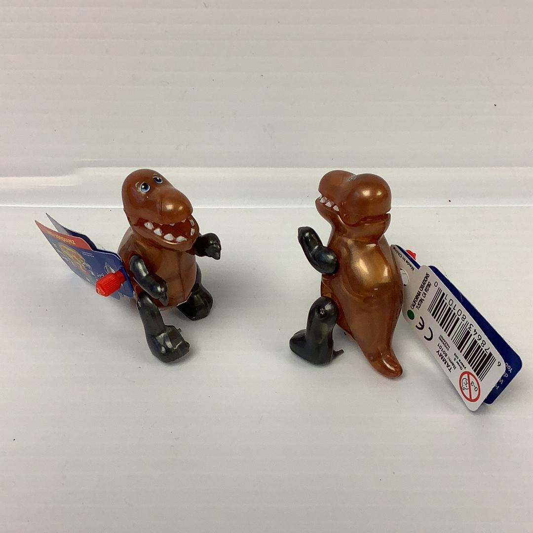 Two small, brown T-Rex figurines with tags, standing side-by-side for California Creations 80101