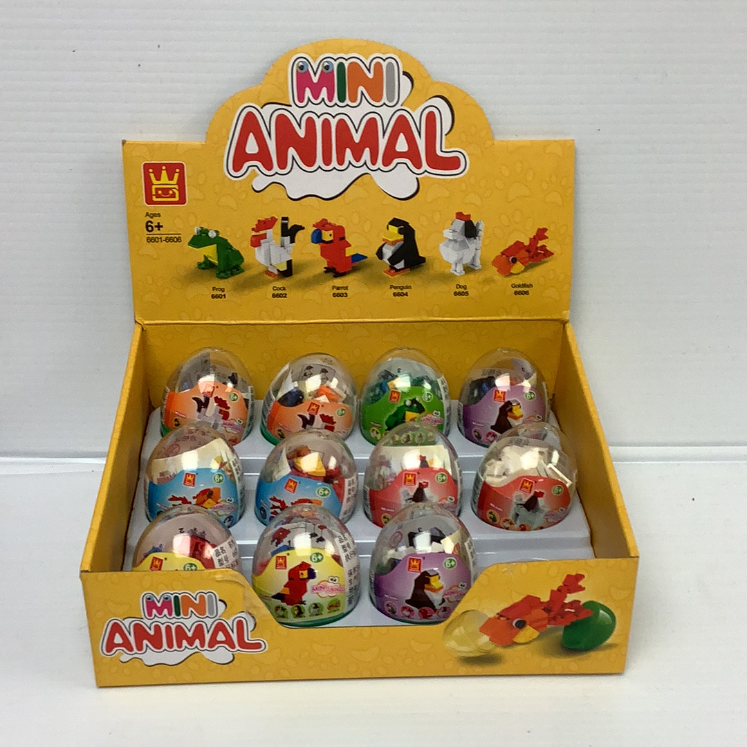 Assortment of mini animal egg-shaped toys in a yellow cardboard box for IMEX Model Company WAG66016