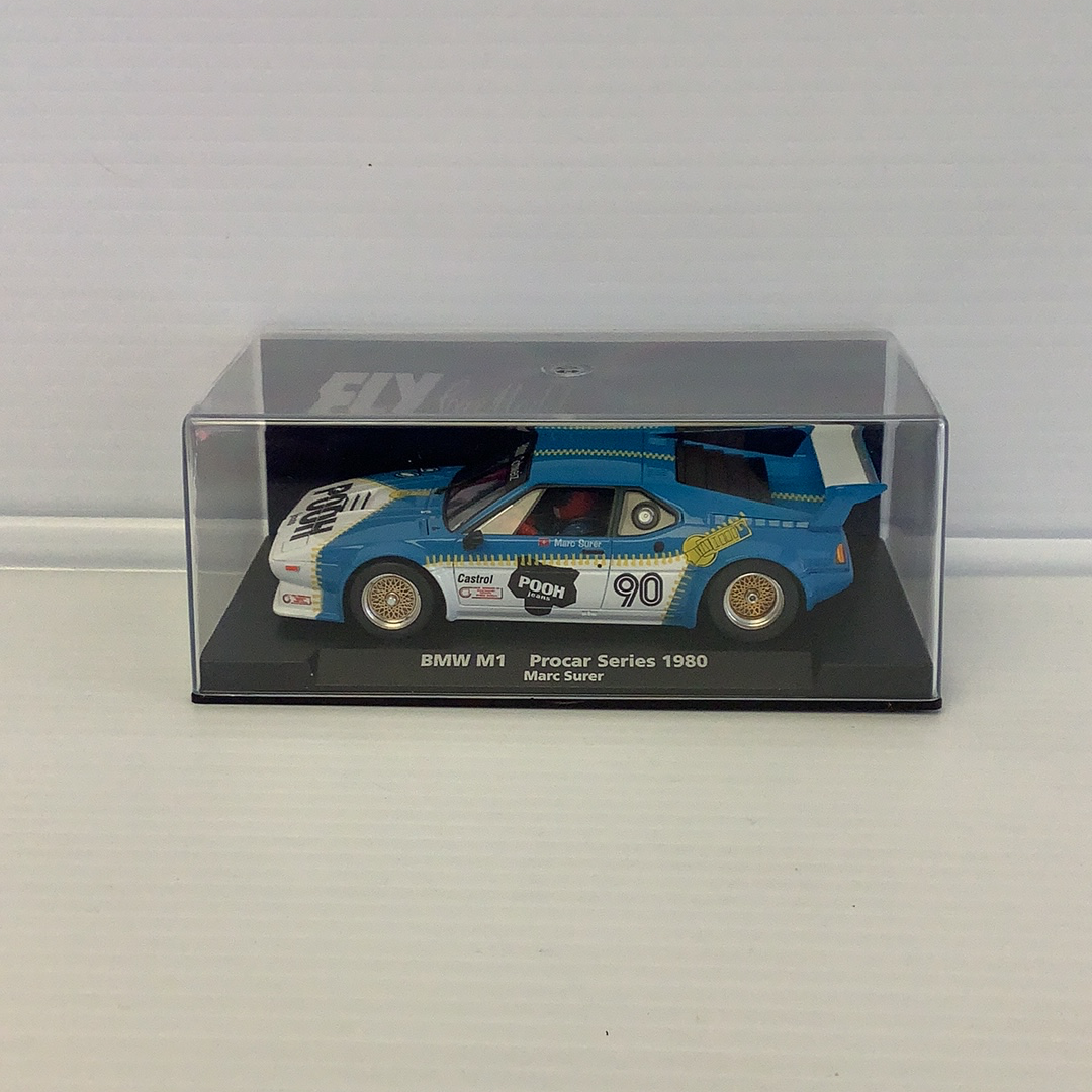 Blue BMW M1 race car model in clear plastic display case for Fly Car 88205